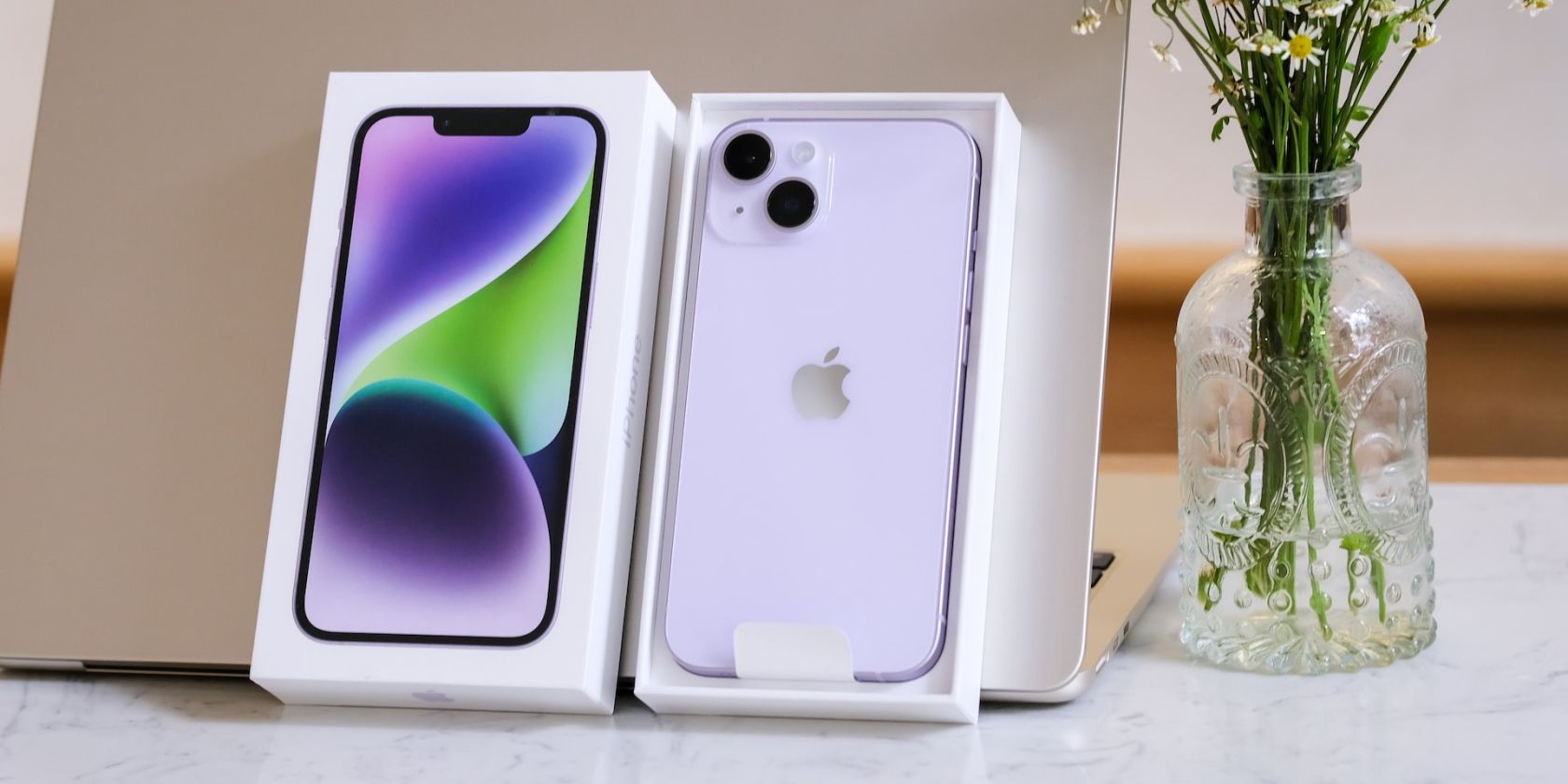 iPhone 14 next to MacBook