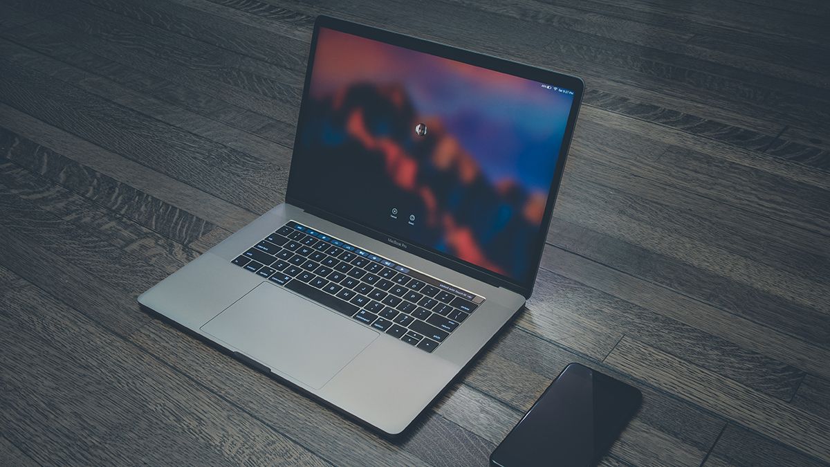 Mac and iPhone on table