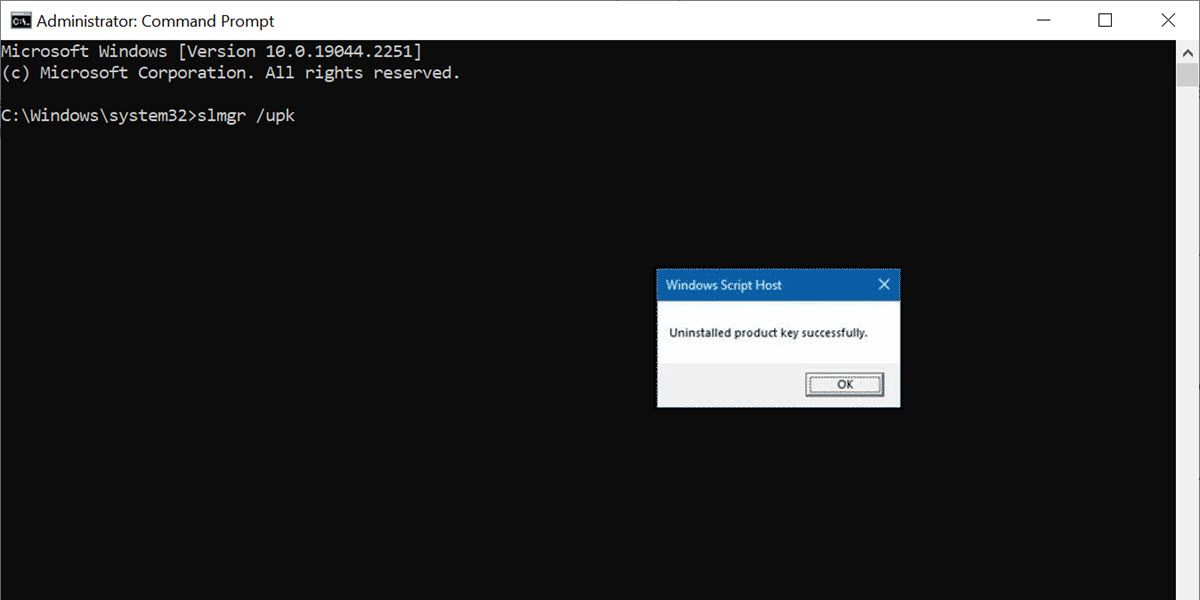 a command prompt window with a confirmation window of product key uninstallation successfully