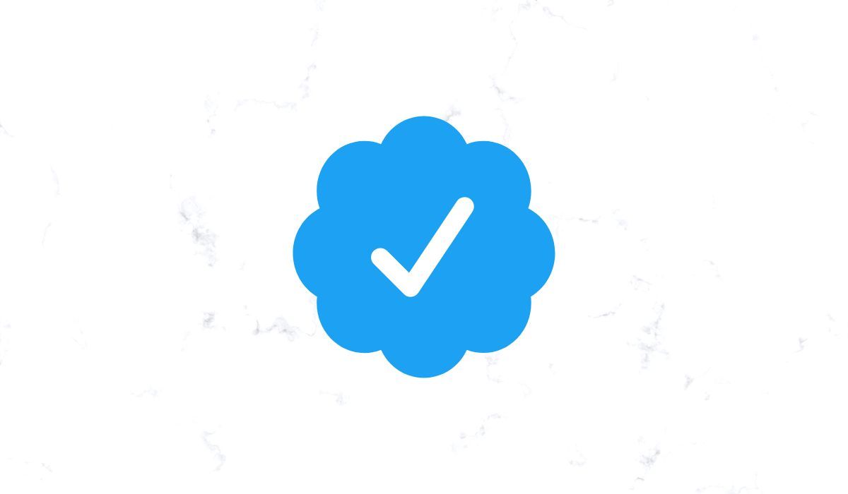 Twitter blue checkmark seen on white background
