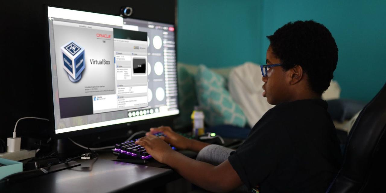 boy working with a virtualbox virtual machine on a pc