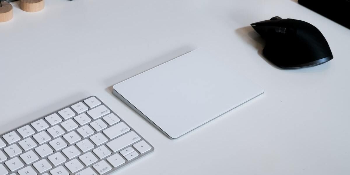 White Apple Trackpad on a desk